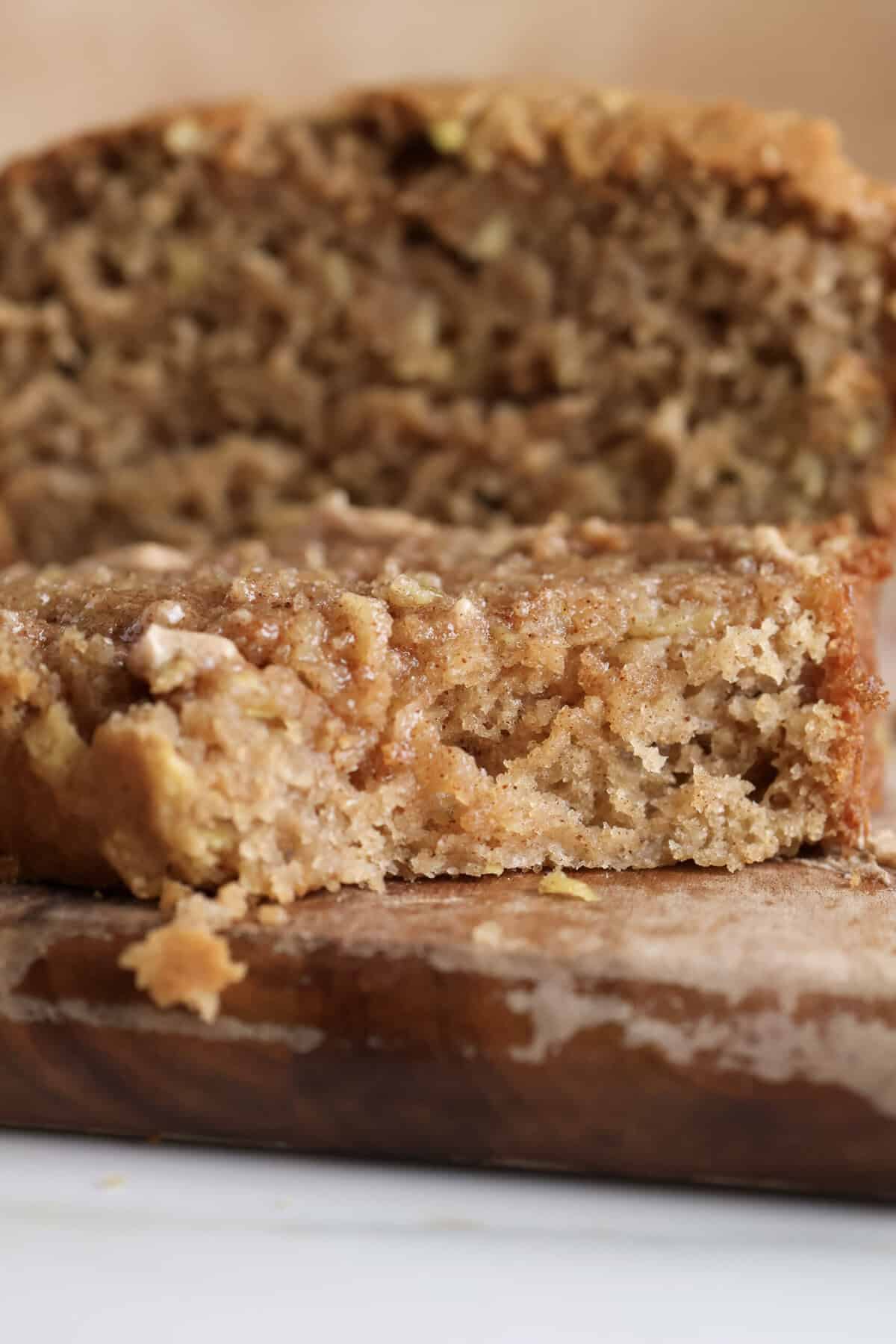 Up close slice of apple bread with cinnamon sugar butter. 