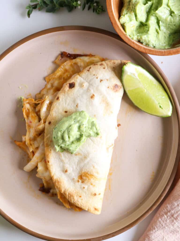 Baked Buffalo Chicken Tacos with Avocado Crema