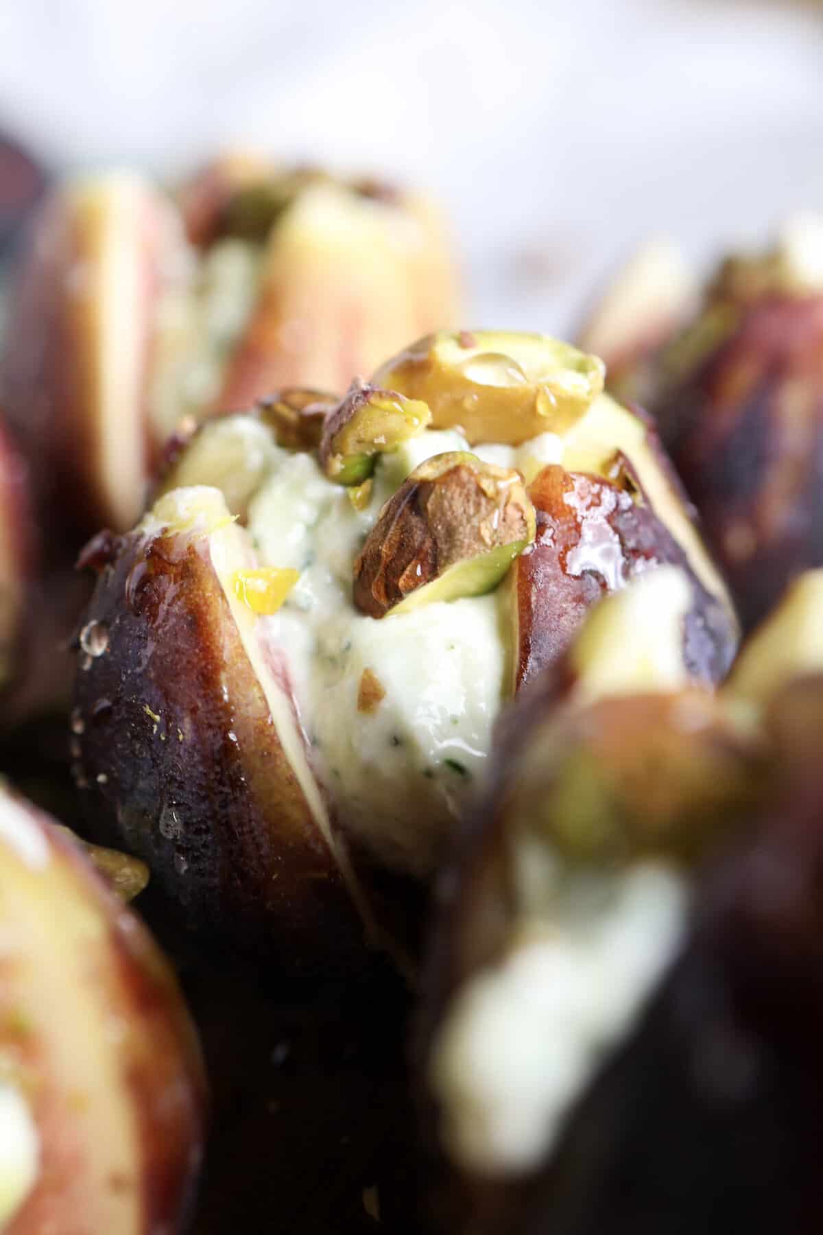 Goat cheese stuffed figs with pistachios and hot honey