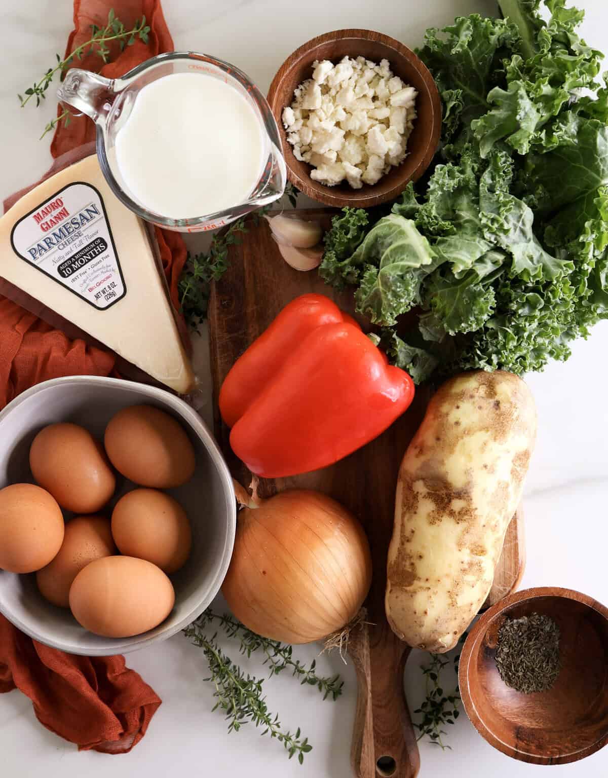 All the ingredients for the gluten-free potato crust quiche with feta and kale.