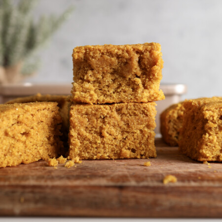 Pumpkin Cornbread slices stacked onto each other.