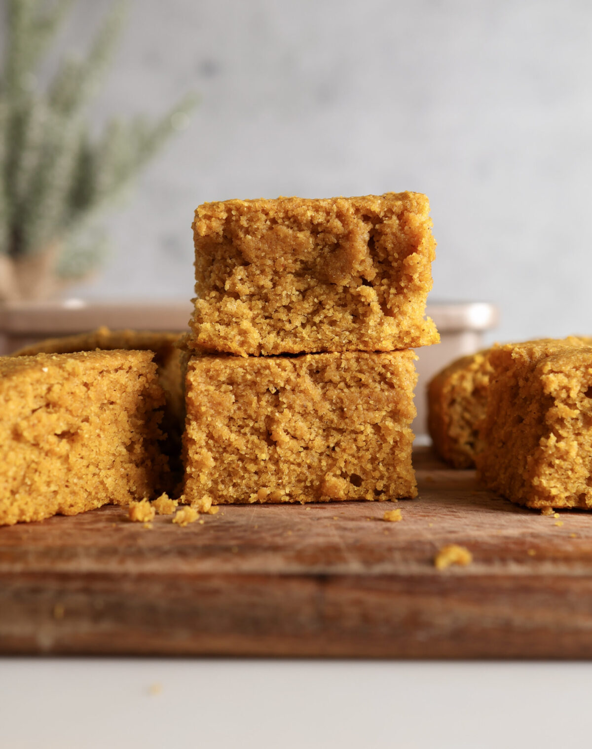Pumpkin Cornbread slices stacked onto each other.