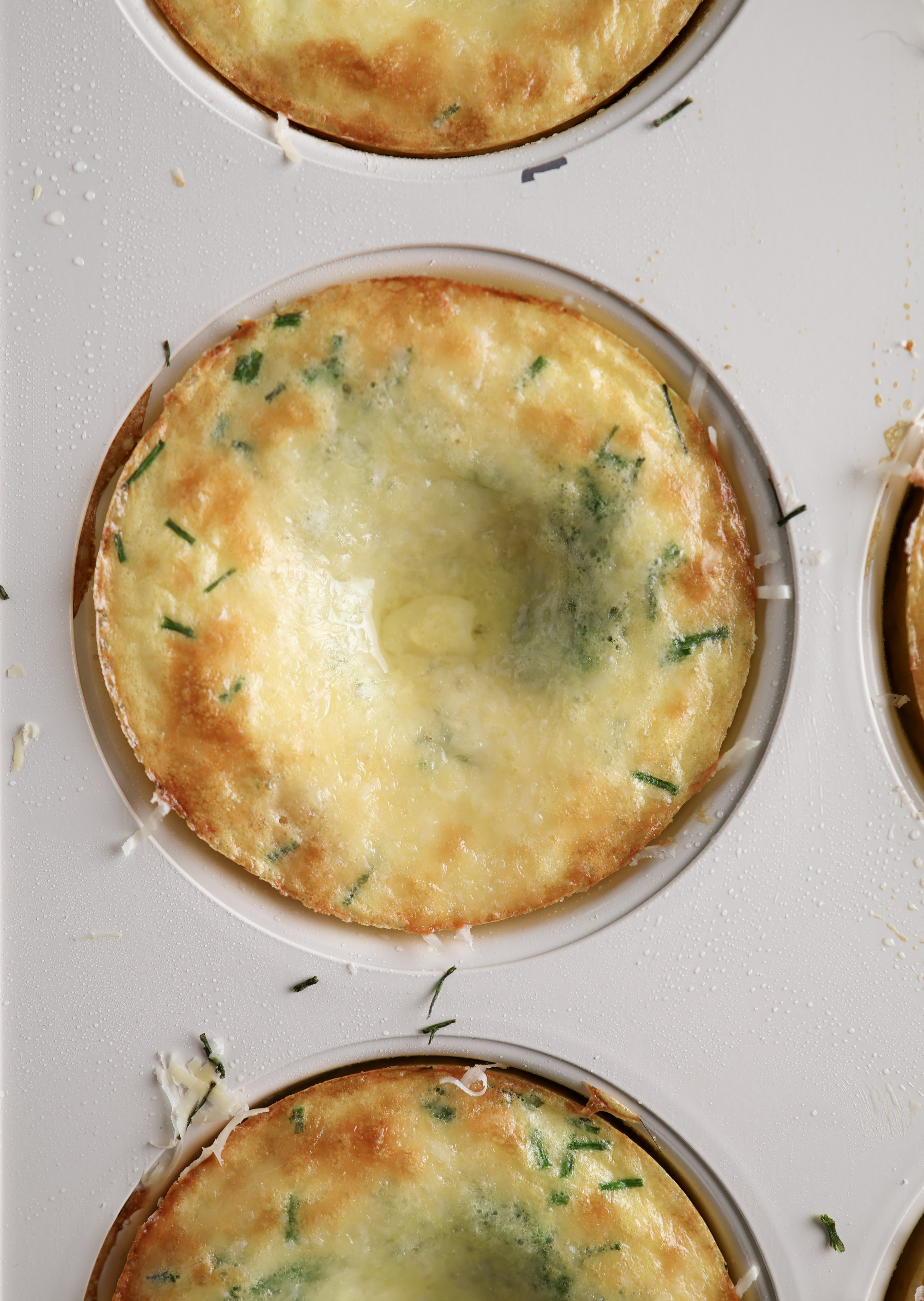 The cooked cottage cheese egg bite right from the oven in the muffin tin. 