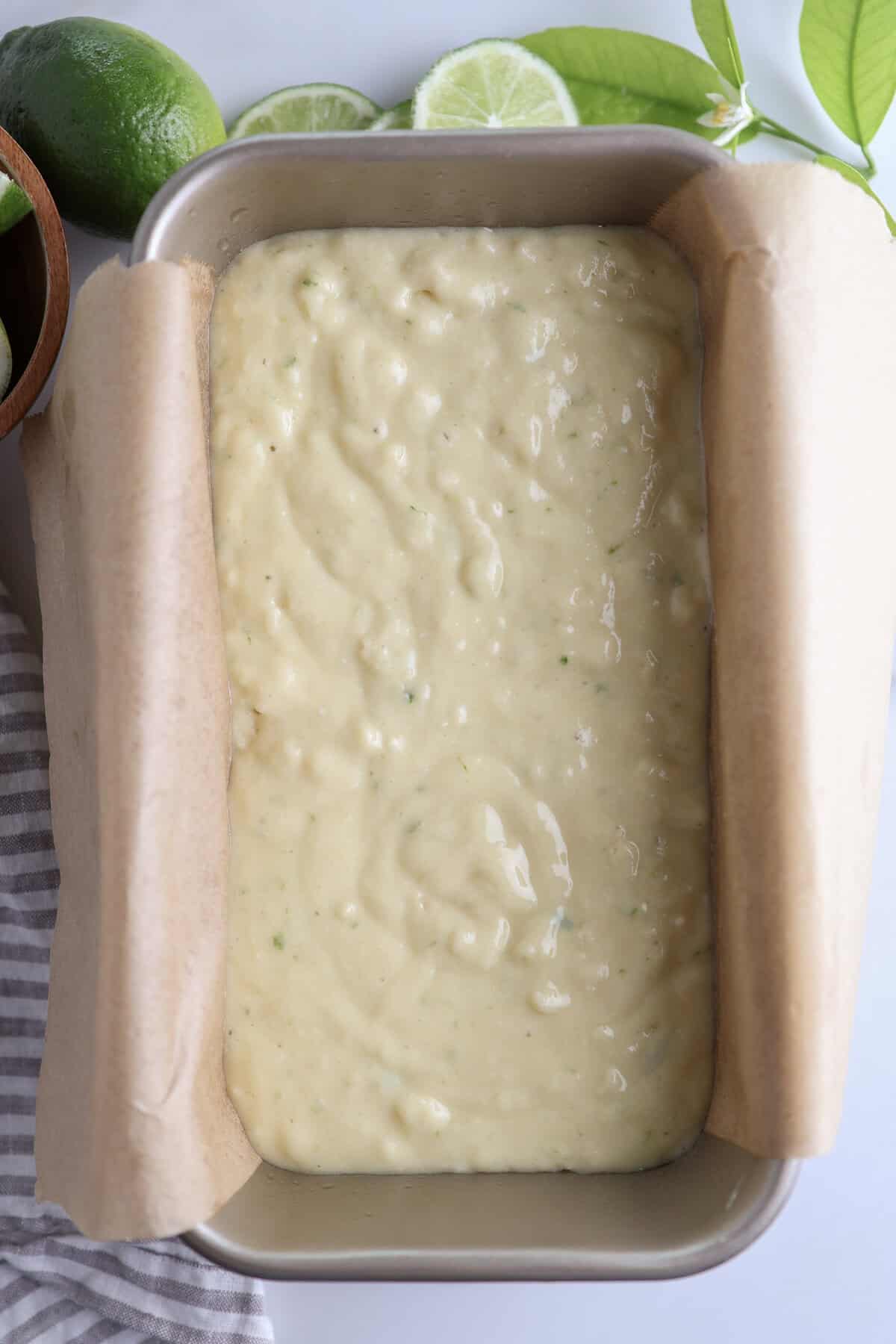 Olive oil lime cake batter in a loaf pan before being baked.