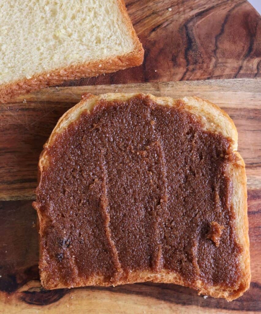 The cinnamon sugar spread out on a slice of brioche bread.
