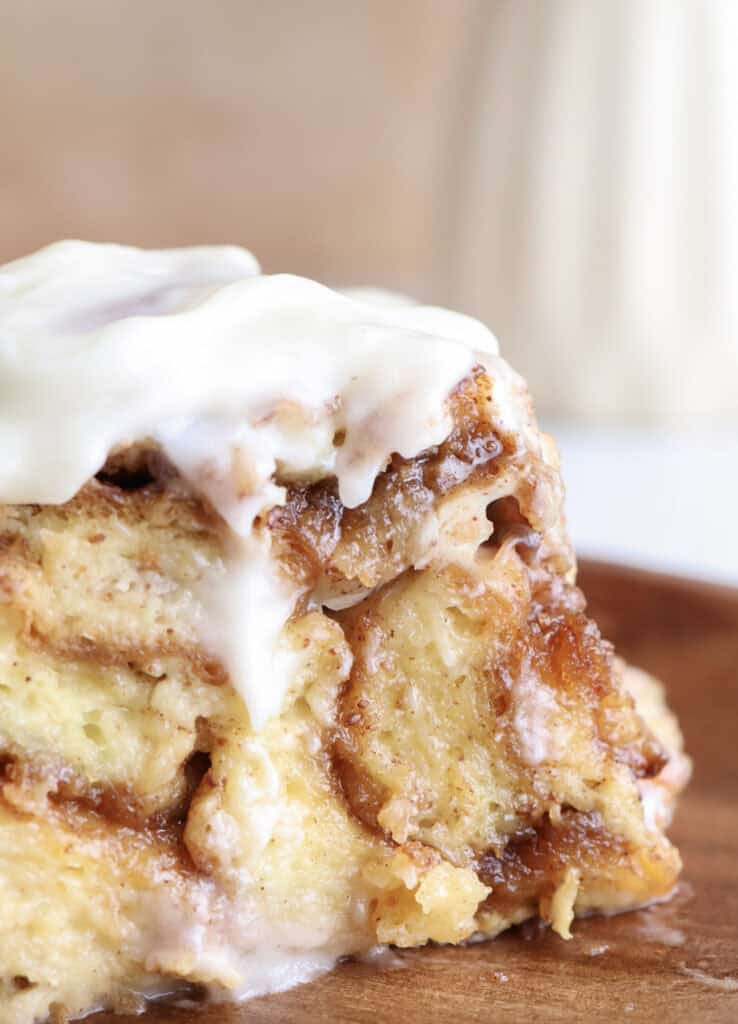 Up close shot of a slice of the cinnamon roll brioche french toast casserole.