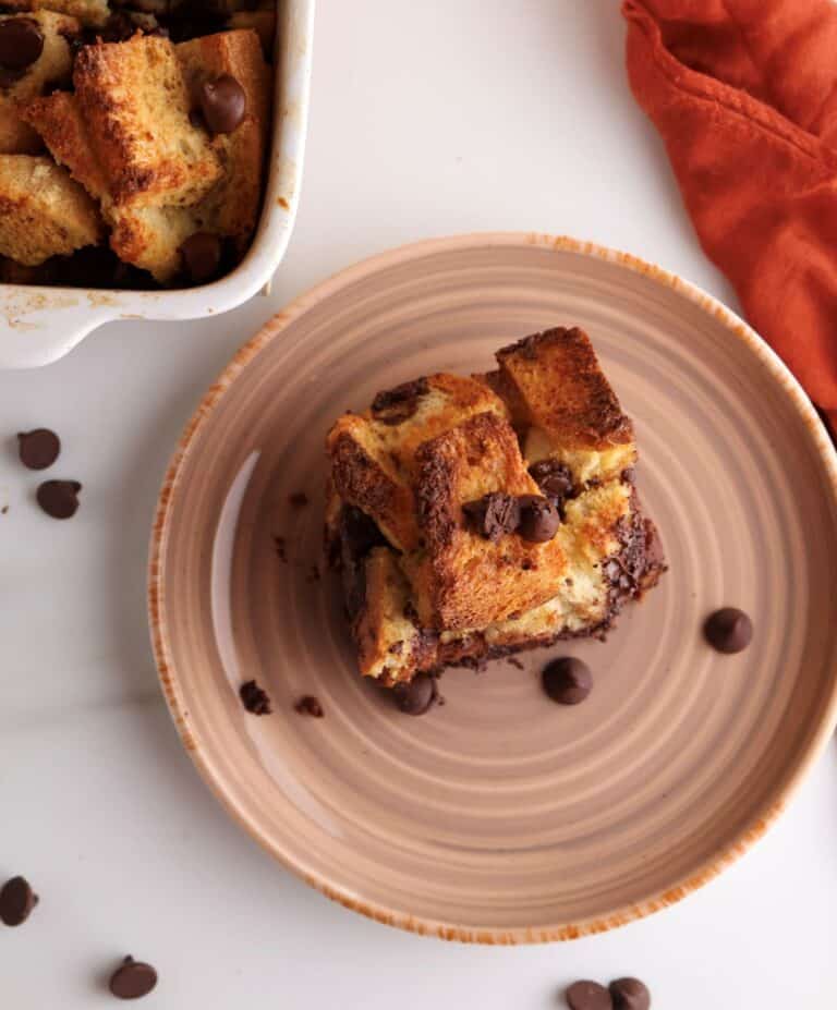 Overhead shot of a slice of the sourdough French toast casserole with chocolate chips.