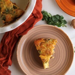 Slice of roasted potato breakfast casserole on a plate.