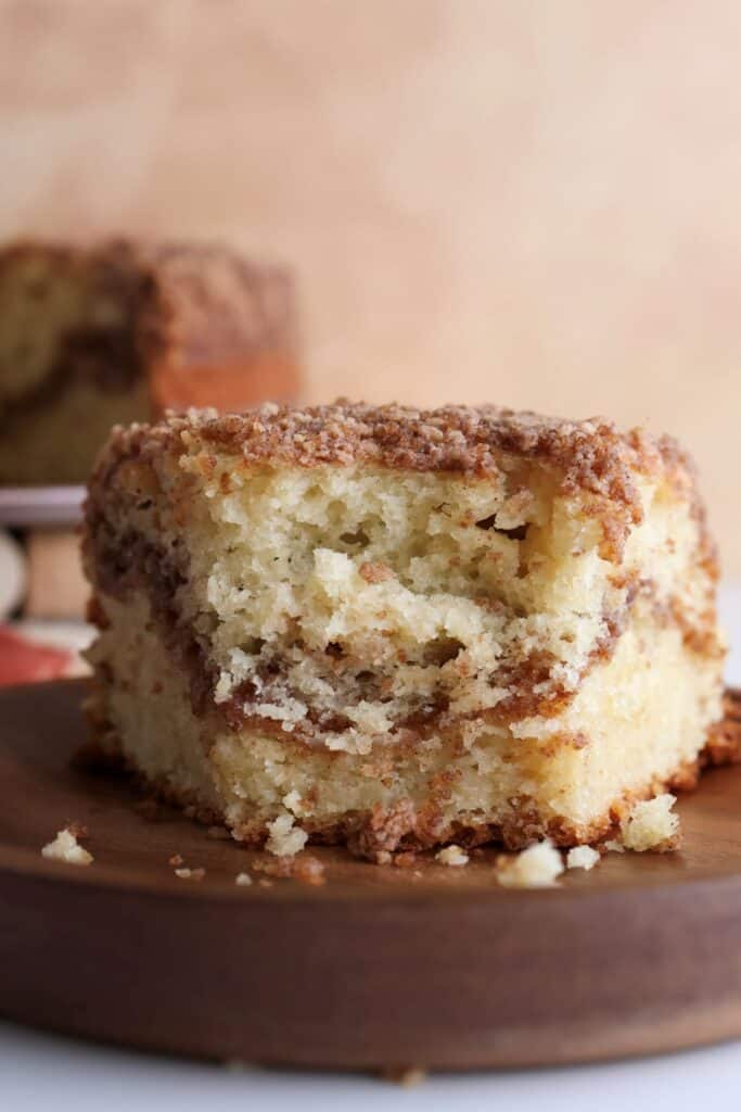 Slice of sourdough discard coffee cake with a bite.