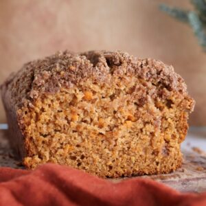 Sweet potato bread cut into on a cutting board.