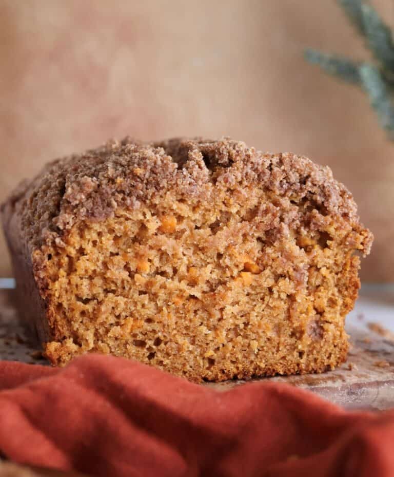 Sweet potato bread cut into on a cutting board.
