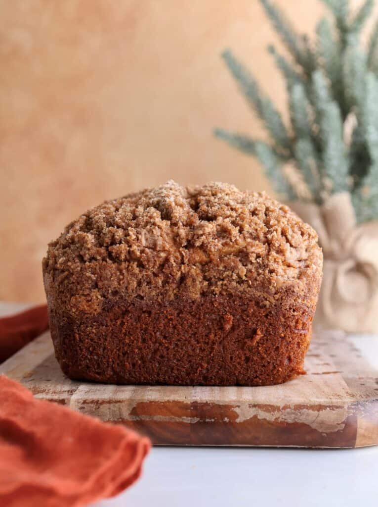 Whole sweet potato loaf on a cutting board.