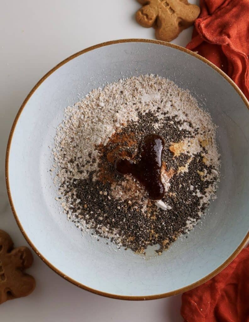 gingerbread overnight oat ingredients in a bowl