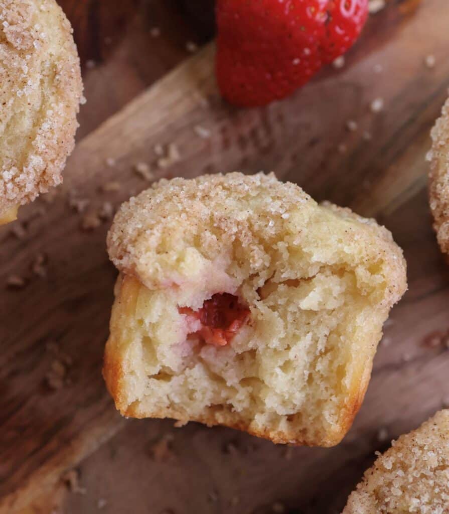 Strawberry lemon muffin with a bite.