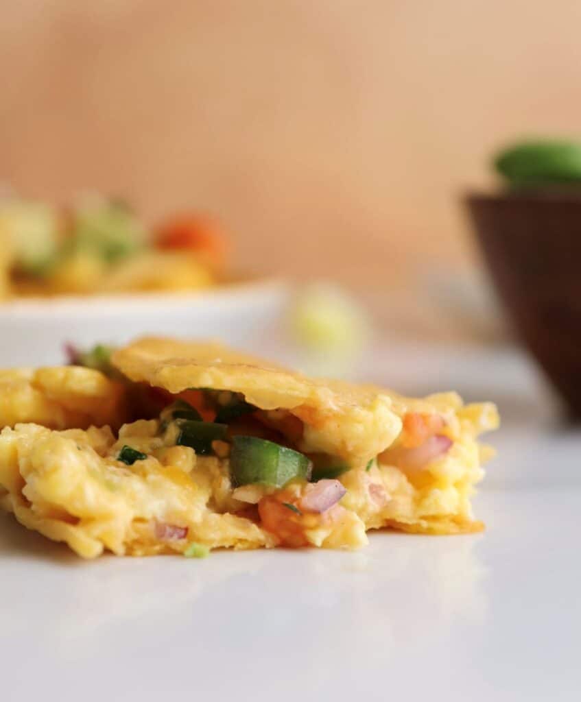 Breakfast egg taco with a bite. 