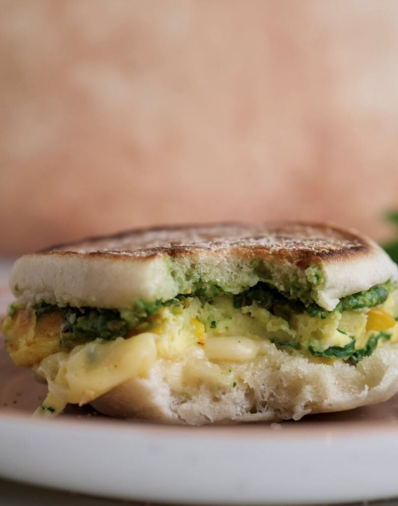 Up close freezer breakfast sandwich with a bite.