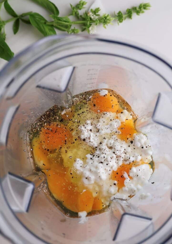 The eggs and cottage cheese in blender for the breakfast sandwiches.
