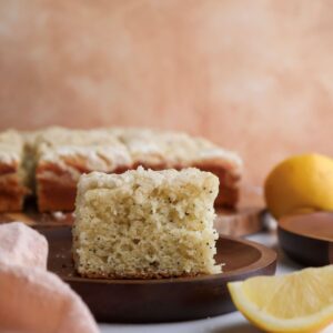 Slice of lemon poppyseed coffee cake on a plate.