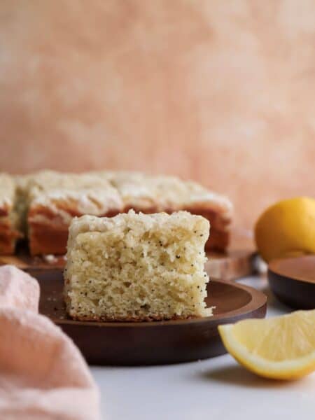 Slice of lemon poppyseed coffee cake on a plate.