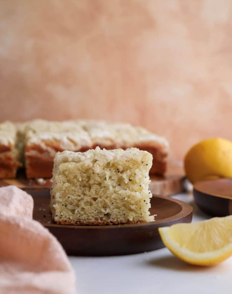Slice of lemon poppyseed coffee cake on a plate.
