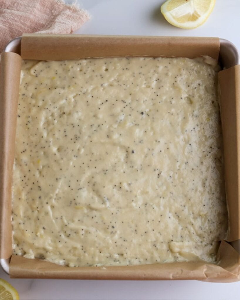 Lemon poppyseed coffee cake batter in a baking pan. 