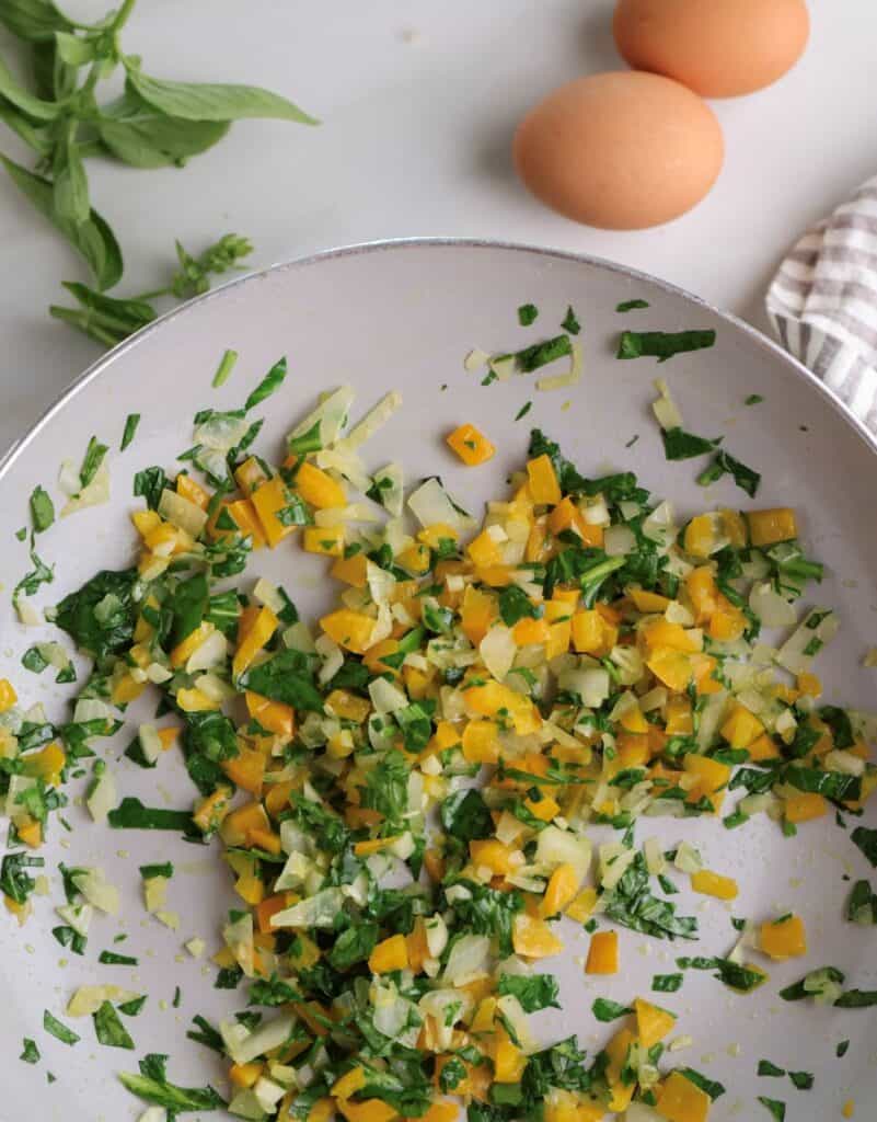Sauteed vegetables for the baked eggs used in the freezer breakfast sandwiches.