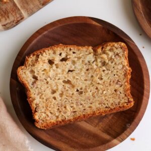 Slice of sourdough discard banana bread on a plate.