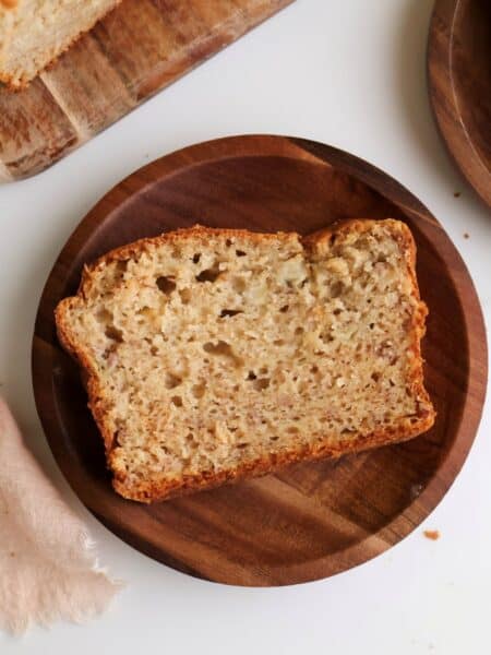 Slice of sourdough discard banana bread on a plate.