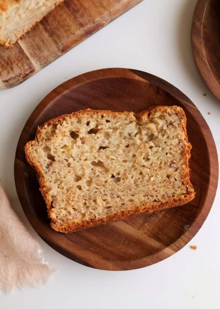 Slice of sourdough discard banana bread on a plate.