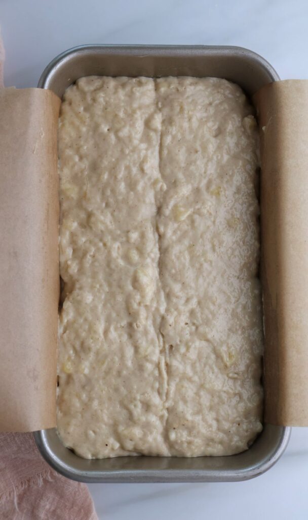 Sourdough discard banana bread batter in a loaf pan.