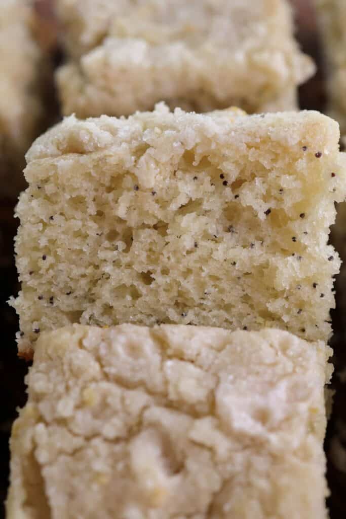 Up close slice of lemon poppyseed coffee cake. 