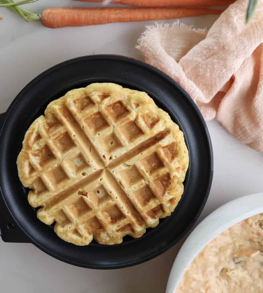 Carrot cake waffle cooked in waffle maker.