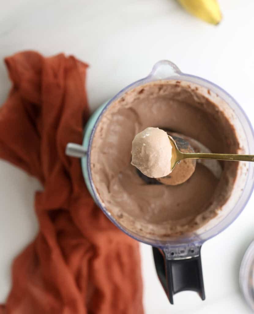 The cottage cheese chocolate mousse on a spoon.