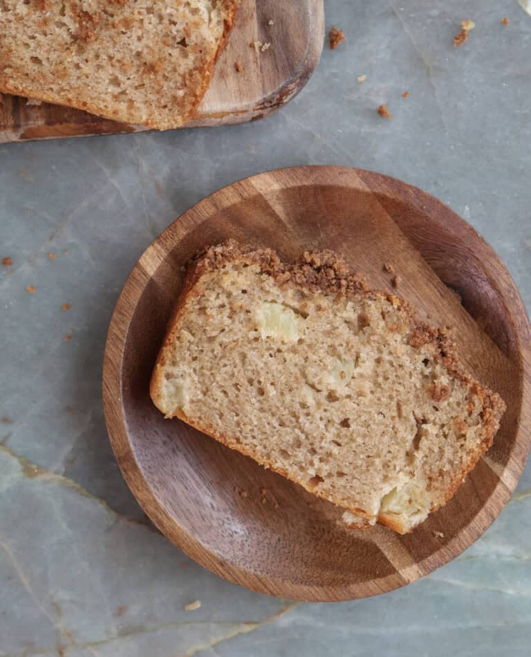 Slice of peach cobbler bread on a plate.
