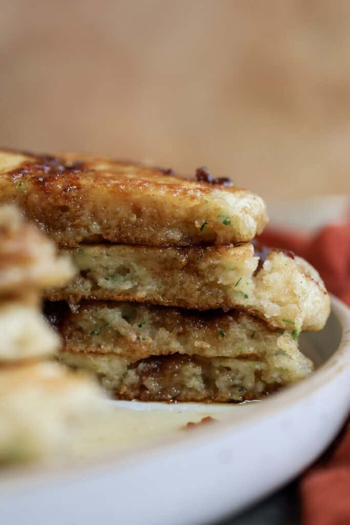 Up close shot of cinnamon roll and zucchini buttermilk pancakes cut open. 