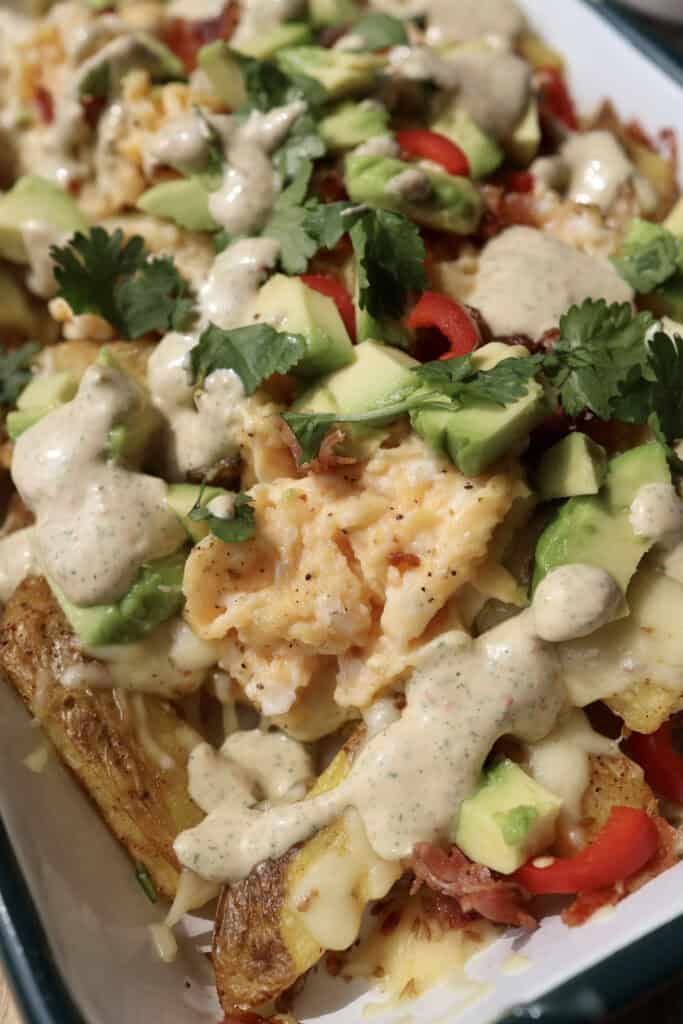 Up close of the spicy loaded breakfast fries in serving dish.