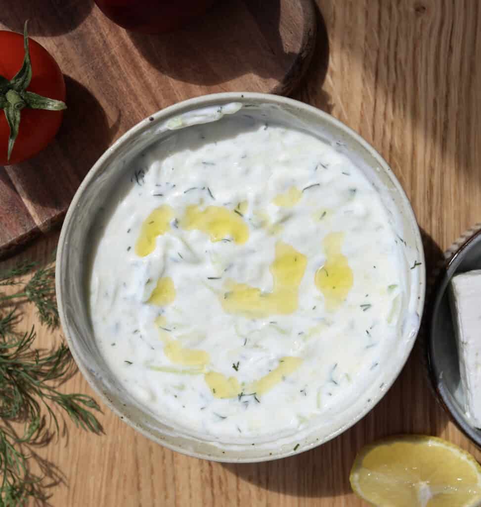 Up close of the homemade tzatziki sauce in a bowl.