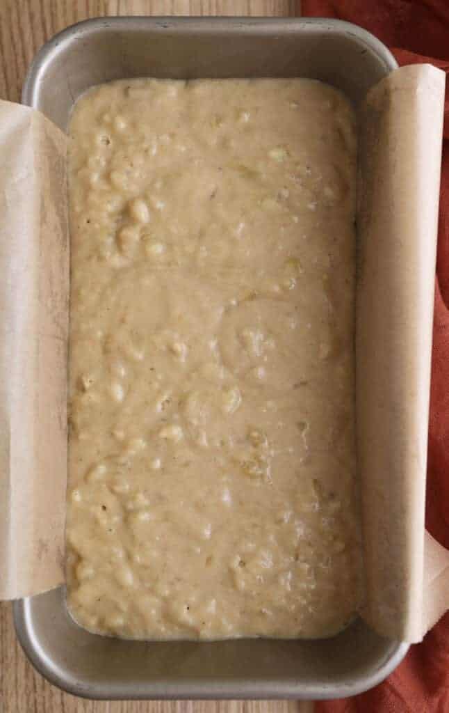 Banana bread with brown butter batter in a loaf pan.