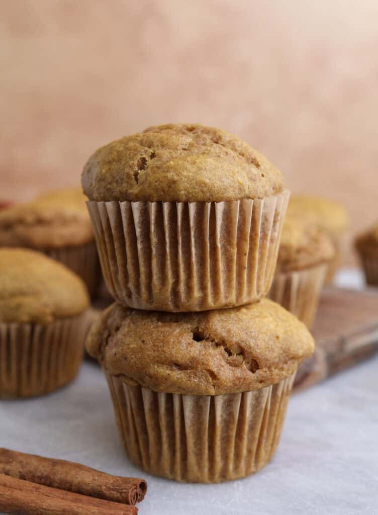 Two cottage cheese pumpkin muffins stacked on each other.