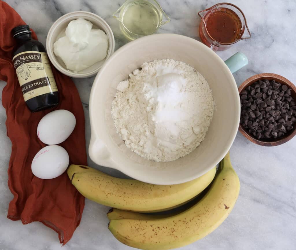 All the ingredients for the banana muffins with chocolate chips on the counter. 