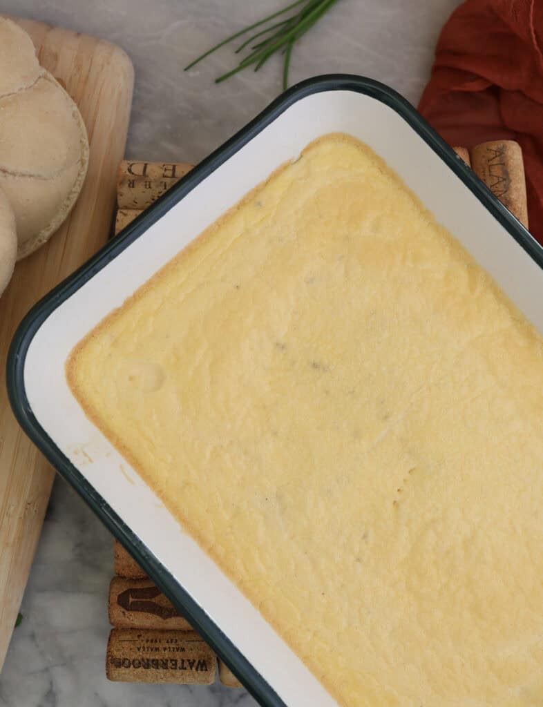The cottage cheese eggs in a baking pan ready to build the freezer friendly breakfast sandwiches.