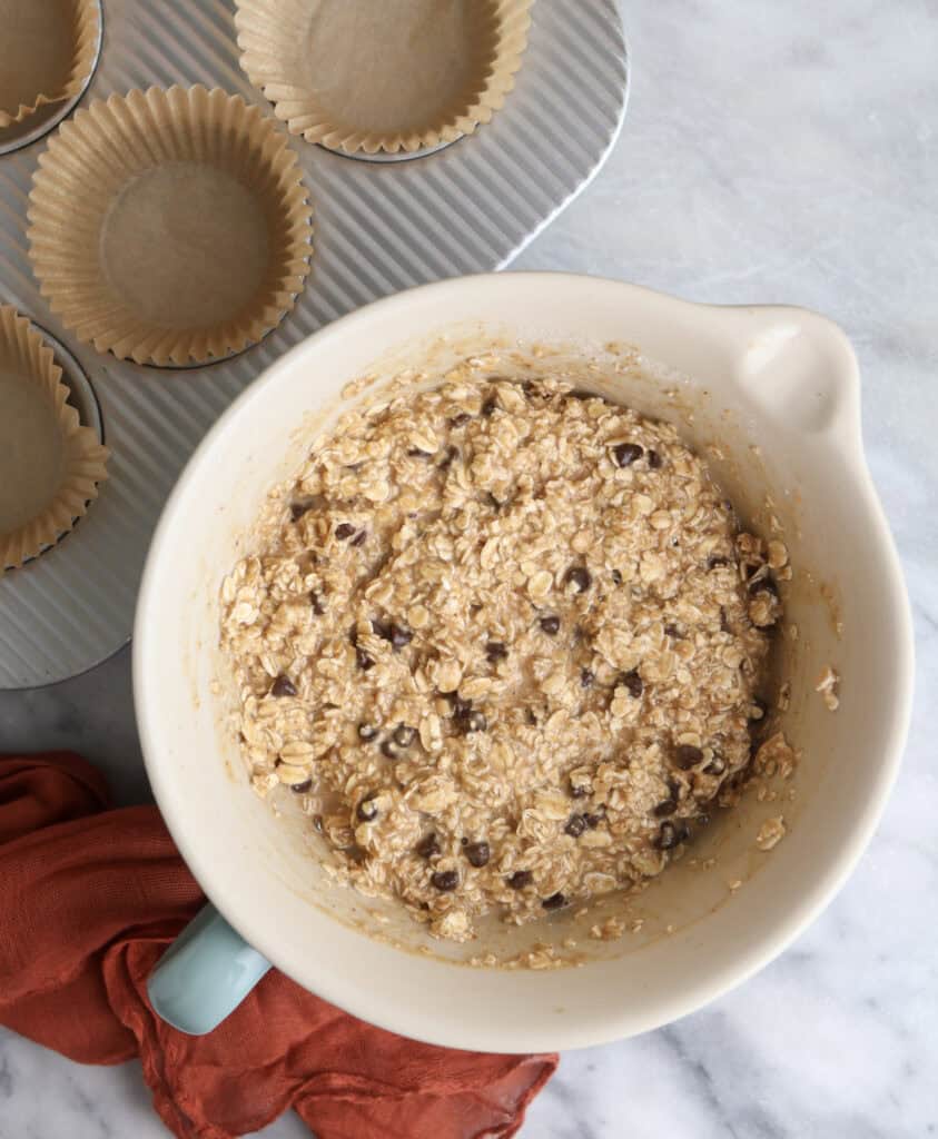 The oat mixture in a bowl before going into the muffin tin to be baked.