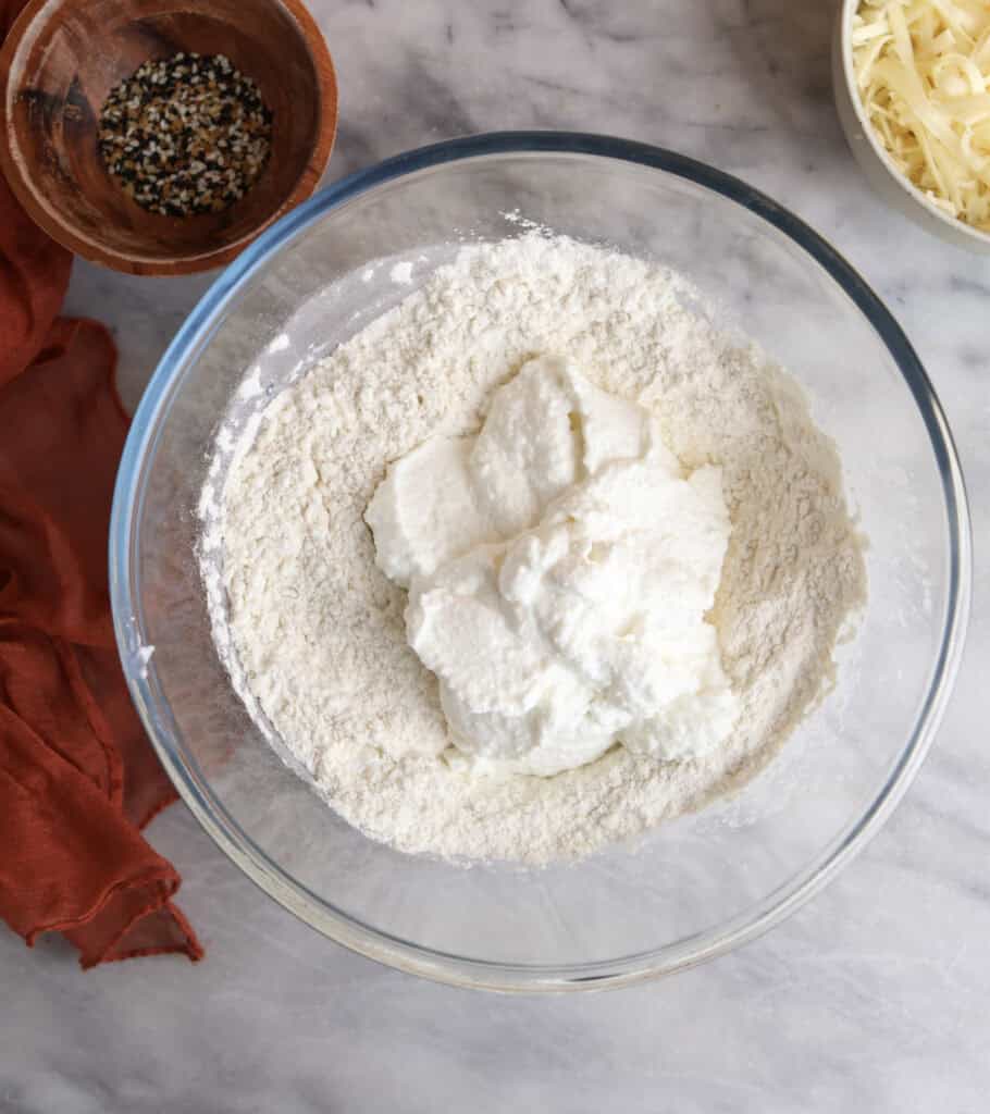 The blended cottage cheese sitting in the bowl with flour mixture.