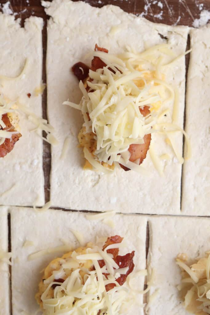 The cottage cheese dough rolled out with the scrambled eggs, bacon and cheese.