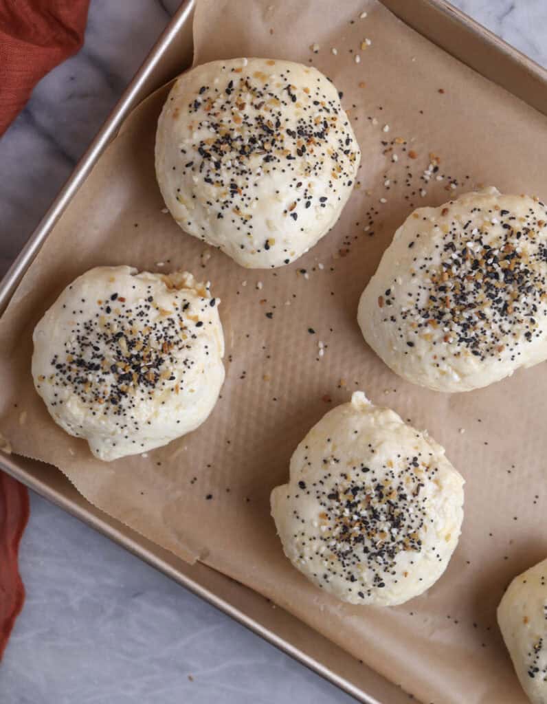breakfast pockets on a baking sheet ready to into the oven.