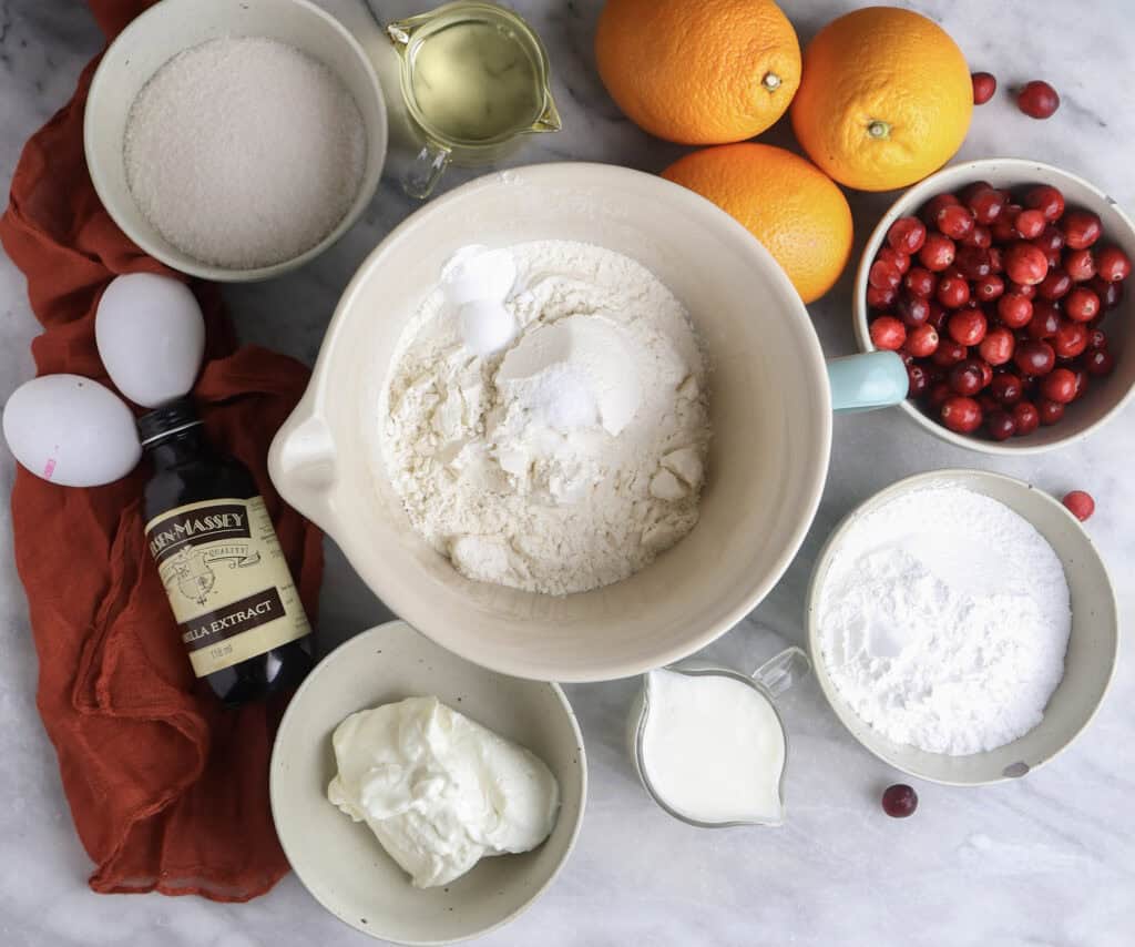 The ingredients needed to make the cranberry orange loaf cake.
